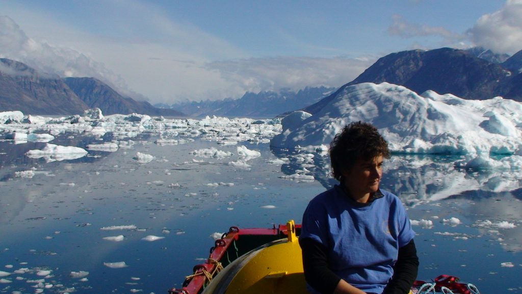 Fiamma Straneo on a boat surrounded by icebergs.